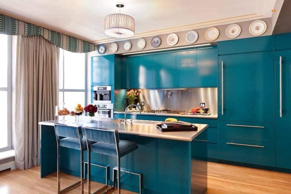 Turquoise-Blue-Kitchen-with-Wooden-Flooring-accommodates-Rectangular-Kitchen-Island-with-White-Italian-Marble-Counter-top-Blue-Velvet-Cantilevered-Bar-Chairs-and-White-Single-Bowl-Sink. Design Detail Banner 0