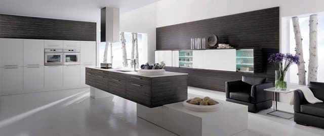 Ultra-Modern-Kitchen-designed-with-Kitchen-Island-Counter-containing-Built-in-Induction-Hob-with-Island-Chimney. Swiper Content 0