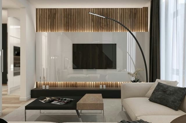 Wall-Mounted-T.V.-Unit-having-Wooden-Panelling-with-Vertical-Groove-Patterns-Rectangular-Glossy-White-Mass-with-Indirect-lights-for-TV-Panel. Swiper Content 0