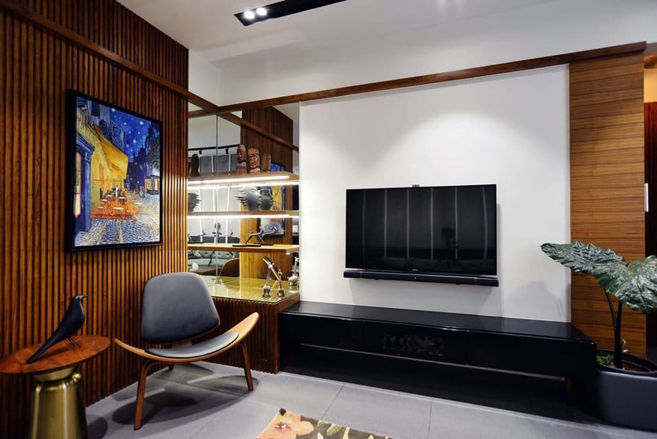 Wall-mounted-T.V.-Unit-with-Wooden-Storage-Unit-below-White-Coloured-T.V.-Backwall-Linear-Shelves-besides-T.V.-Unit-for-keeping-Antiques Design Detail Banner 0