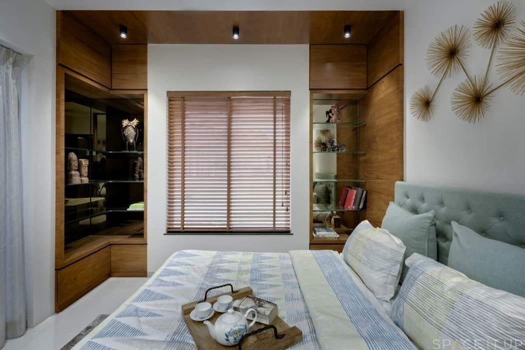 White-Wooden-Themed-Contemporary-Bedroom-designed-with-Wooden-Bed-Button-Tufted-Headboard-Side-Tables-with-Table-Lamp-placed-on-it-2 Design Detail Banner 1