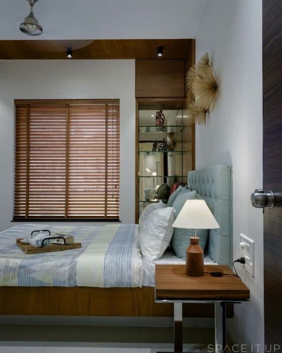 White-Wooden-Themed-Contemporary-Bedroom-designed-with-Wooden-Bed-Button-Tufted-Headboard-Side-Tables-with-Table-Lamp-placed-on-it-3 Swiper Content 2