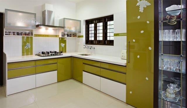 White-Yellow-Themed-L-Shaped-Kitchen-designed-with-White-Acrylic-Polished-Corian-Countertop-Lower-Base-Cabinets-Wall-Cabinets-Stove-over-the-Modular-Chimney Swiper Content 0