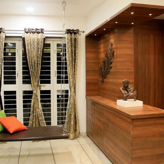 Wooden-Swing-with-a-Metal-String-hung-with-Colourful-Cushions Swiper Content 0