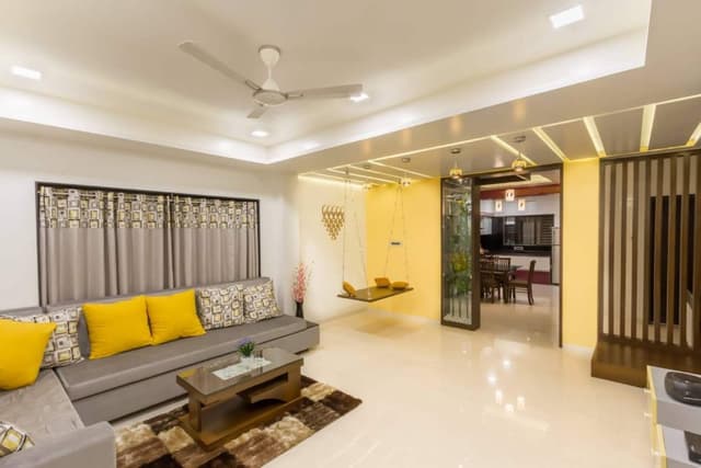 Yellow-Grey-White-Themed-Living-Room-incorporates-L-Shaped-Upholstered-Sectional-Sofa-with-Attached-Side-Tables Swiper Content 1