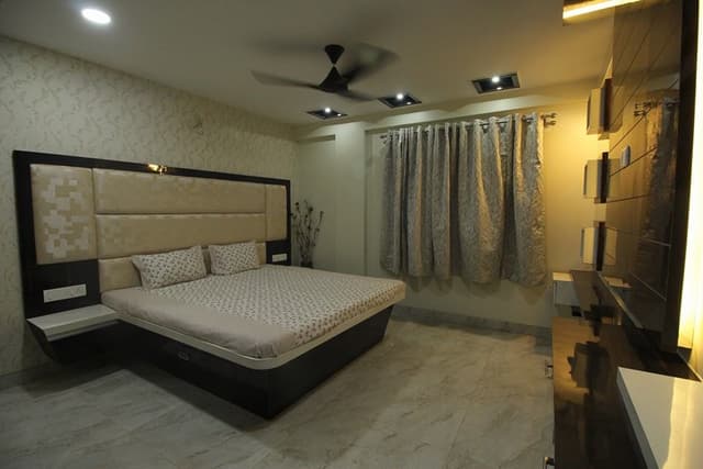 Bedroom designed with Wooden Bed, Side Tables attached with High Cushioned Headboard – 1 Bedroom designed with Wooden Bed, Side Tables attached with High Cushioned Headboard