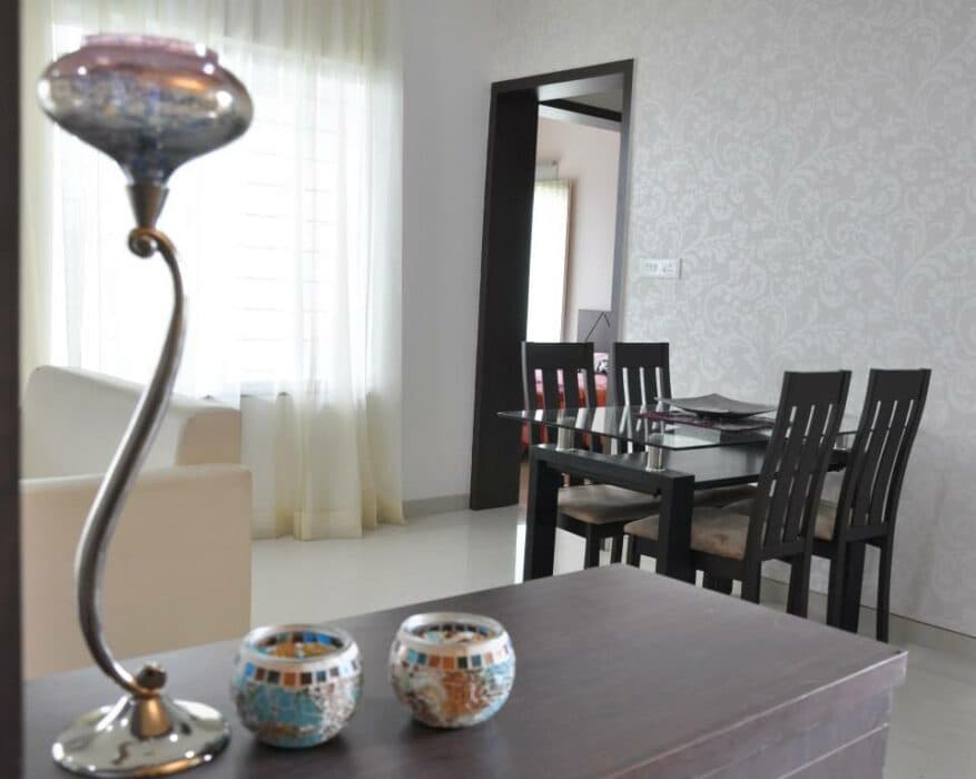 Classic wooden dining table and chair painted in dark brown Classic wooden dining table and chair painted in dark brown