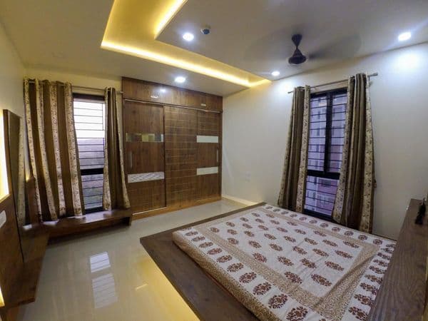 A minimalistic bedroom with wood all over the room A minimalistic bedroom with wood all over the room