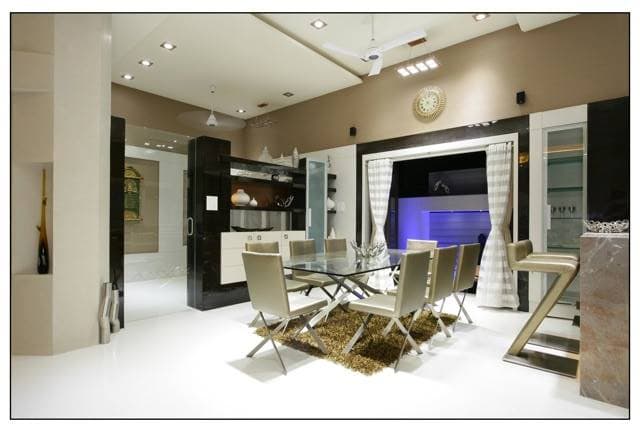 A modern dining set up with white flooring A modern dining set up with white flooring