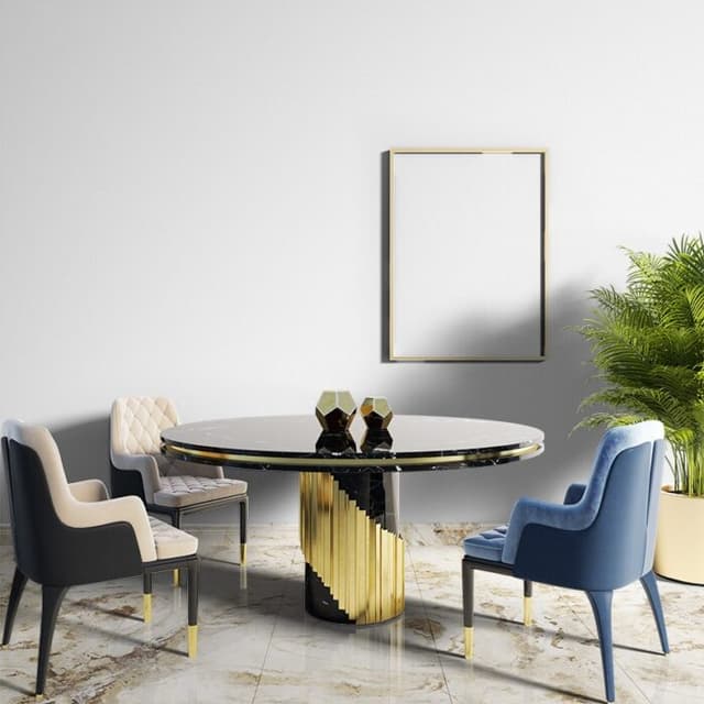 A black granite circular dining table A black granite circular dining table