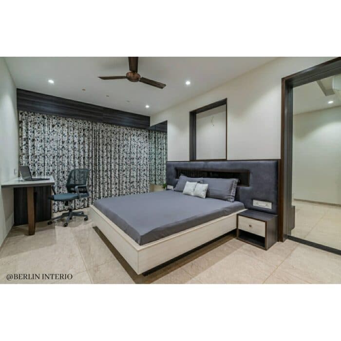 A modern compact bedroom in greys and white A modern compact bedroom in greys and white