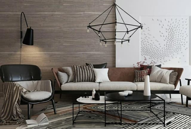 3 Seater Upholstered Sofa having an Inclined Armrest is Placed with Black & Grey Upholstered Chairs in this Living Room 3 Seater Upholstered Sofa having an Inclined Armrest is Placed with Black & Grey Upholstered Chairs in this Living Room