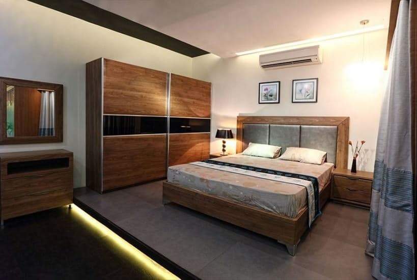 Modern Bedroom with a Wooden Rectangular Bed with Grey Cushioned Backrest & Wooden Frame Modern Bedroom with a Wooden Rectangular Bed with Grey Cushioned Backrest & Wooden Frame