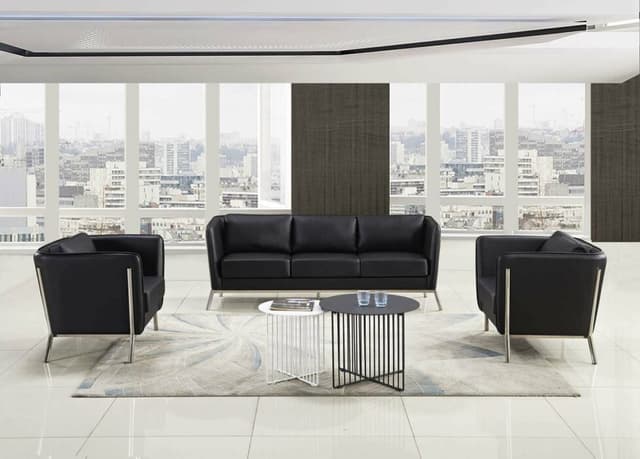 The 3 Seater Black Leather Upholstered Sofa & 2 -Single Seater Sofa Chairs with S.S. Framed Legs is Making great Contrast with White Colour The 3 Seater Black Leather Upholstered Sofa & 2 -Single Seater Sofa Chairs with S.S. Framed Legs is Making great Contrast with White Colour