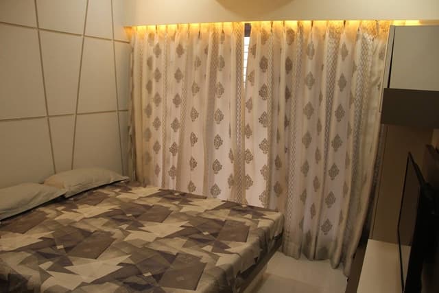 The Bedroom consists of Rectangular Wooden Bed & Wall Mounted T.V. Unit – 1 The Bedroom consists of Rectangular Wooden Bed & Wall Mounted T.V. Unit - 1