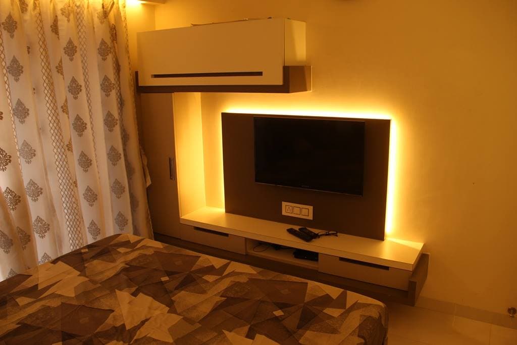 The Bedroom consists of Rectangular Wooden Bed & Wall Mounted T.V. Unit – 2 The Bedroom consists of Rectangular Wooden Bed & Wall Mounted T.V. Unit - 2