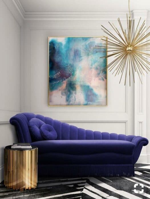The Ink Blue Chaise Lounge Sofa having Velvet Upholstered is Nicely Placed in the Corner with Circular Metal Side Table The Ink Blue Chaise Lounge Sofa having Velvet Upholstered is Nicely Placed in the Corner with Circular Metal Side Table