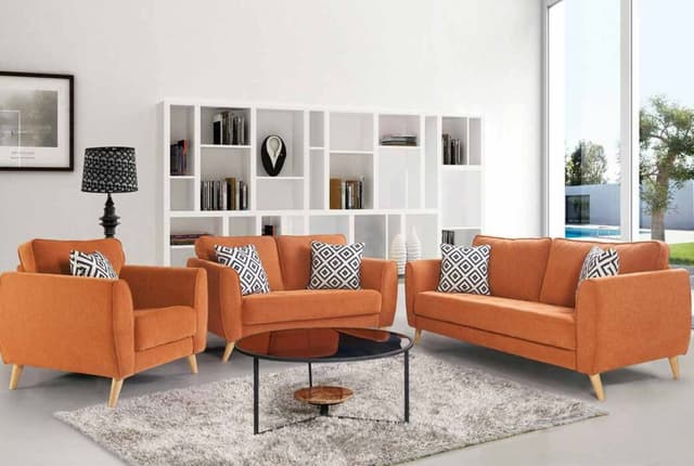 The 2 Seater & 1 Single Seater Orange Upholstered Sofa having Wooden Legs are Nicely Place in the Living Room The 2 Seater & 1 Single Seater Orange Upholstered Sofa having Wooden Legs are Nicely Place in the Living Room
