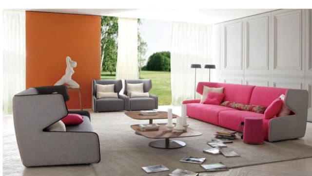 The 3-Seater & Single Seater Grey & Pink Sofa with White & Orange Walls are Making this Space Vibrant The 3-Seater & Single Seater Grey & Pink Sofa with White & Orange Walls are Making this Space Vibrant
