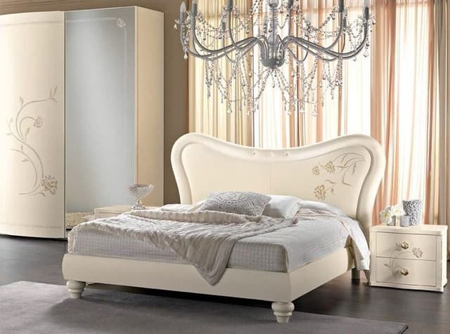 The Bedroom having a Combination of Off White & Grey consists of Ultra luxurious Wooden Bed & Traditional Style Wooden Legs The Bedroom having a Combination of Off White & Grey consists of Ultra luxurious Wooden Bed & Traditional Style Wooden Legs