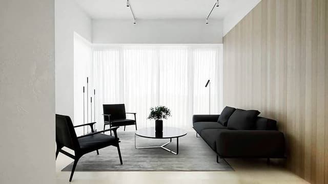 The Black Upholstered 2 Seater Sofa having Metal Legs is Nicely Placed in the White Bedroom The Black Upholstered 2 Seater Sofa having Metal Legs is Nicely Placed in the White Bedroom