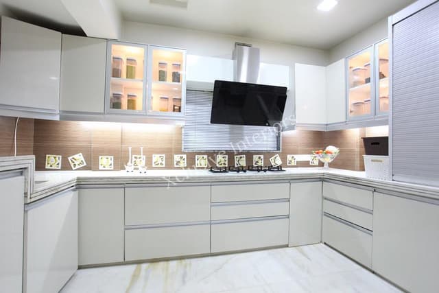 The C-Shape Kitchen Counter Consists of White Granite Top with a Built – In Gas Stove, Chimney & Single Bowl Sink The C-Shape Kitchen Counter Consists of White Granite Top with a Built - In Gas Stove, Chimney & Single Bowl Sink