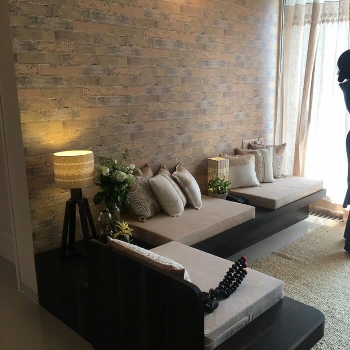 The L-Shape 6 Seater Wooden Sofa having Module of Two Beige Upholstered Seats The L-Shape 6 Seater Wooden Sofa having Module of Two Beige Upholstered Seats