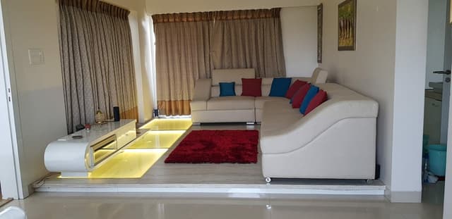 The L – Shape White Leather Upholstered Sofa with S.S. Legs & Curved Armrest Looking Stylish & comfortable The L - Shape White Leather Upholstered Sofa with S.S. Legs & Curved Armrest Looking Stylish & comfortable