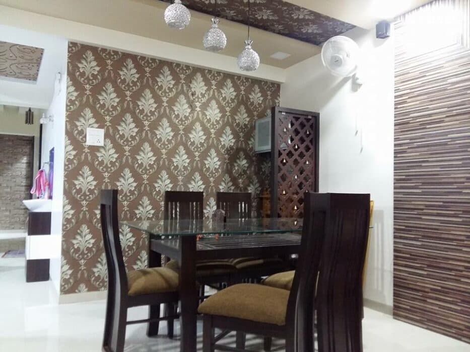 This Dark Brown Wooden Dining Table has Glass Table Top & Wooden Armless Chairs with High Backrests & Cushioned Seating This Dark Brown Wooden Dining Table has Glass Table Top & Wooden Armless Chairs with High Backrests & Cushioned Seating