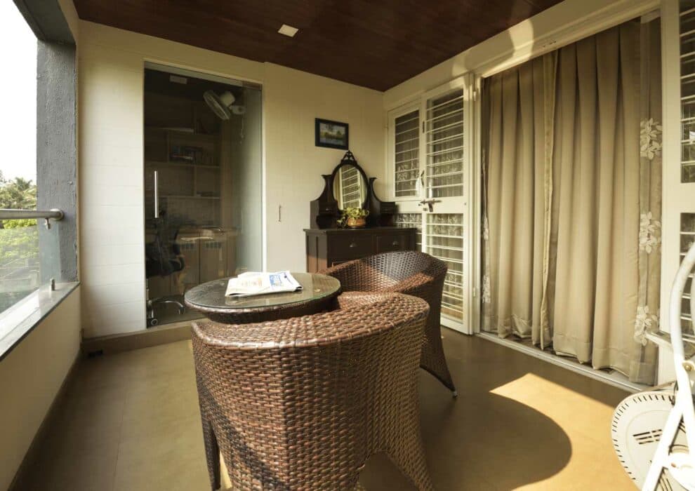 Balcony with 2 Cane Knitted Chairs & Circular Coffee Table Balcony