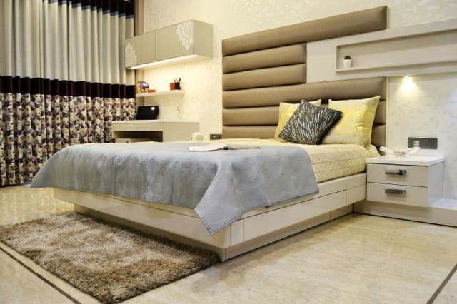 White Rectangular Bed having Beige Cushioned White Rectangular Bed having Beige Cushioned