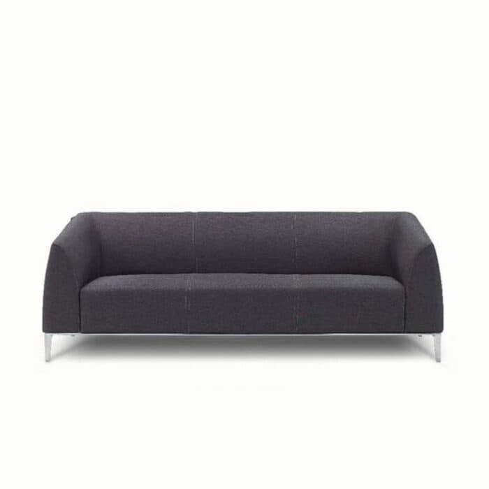 Chic-Modern Living Room a Plush Grey Three-Seater Sofa Chic-Modern Living Room a Plush Grey Three-Seater Sofa
