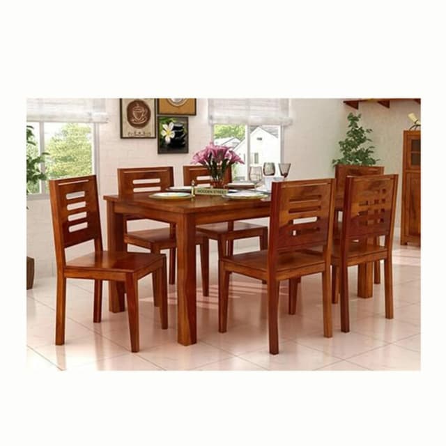 Wooden Dining Table Set in a Warmly Lit Indoor Space Wooden Dining Table Set in a Warmly Lit Indoor Space