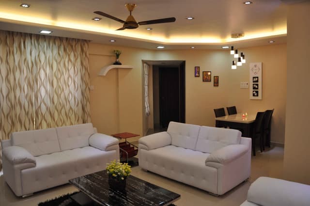 Modern Well-Illuminated Living Room Characterized by Beige Walls Modern Well-Illuminated Living Room Characterized by Beige Walls