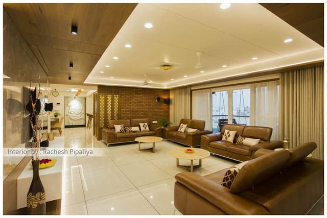 Spacious Living Room with High Ceilings Spacious Living Room with High Ceilings and Predominantly White Decor