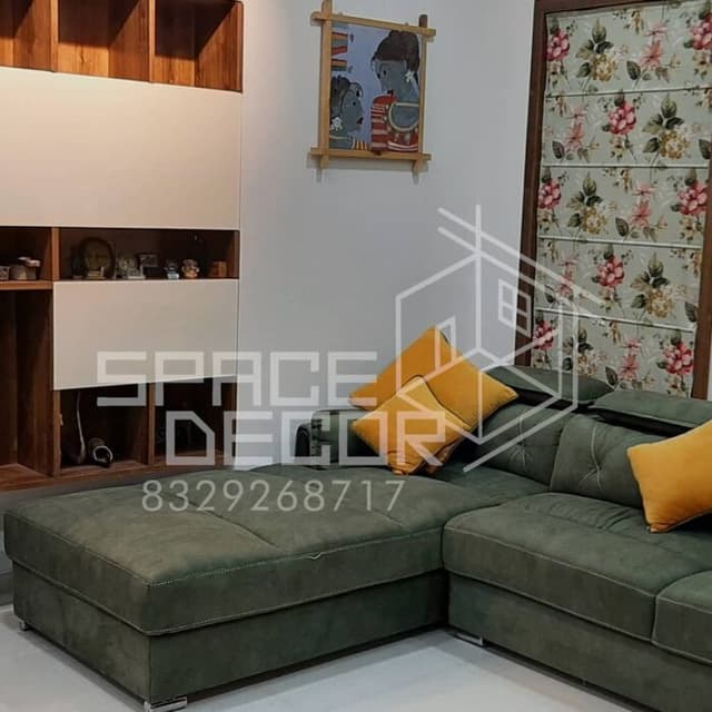 Living Room Featuring a Plush L-Shaped Green Sofa Living Room Featuring a Plush L-Shaped Green Sofa