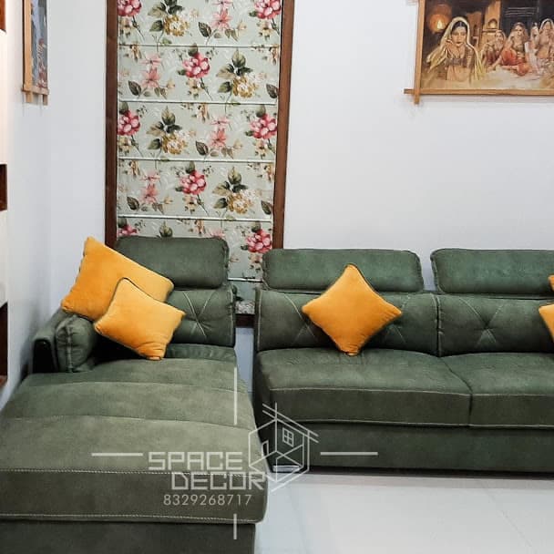 Living Room Featuring a Plush L-Shaped Green Sofa Living Room Featuring a Plush L-Shaped Green Sofa