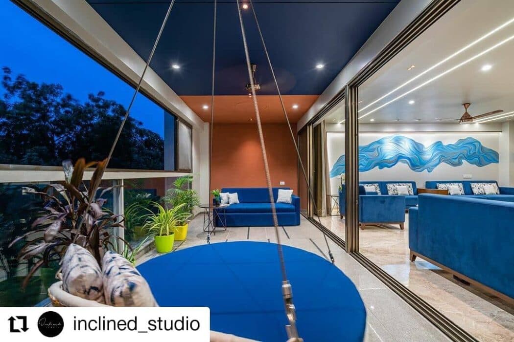 Elegant Indoor-Outdoor Living Space Features a Cosy Swing Elegant Indoor-Outdoor Living Space Features a Cosy Swing